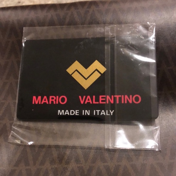 Mario Valentino Crossbody Bag
Mario Valentino
Size: 11 × 8 × 3.5 - Picture 10 of 11